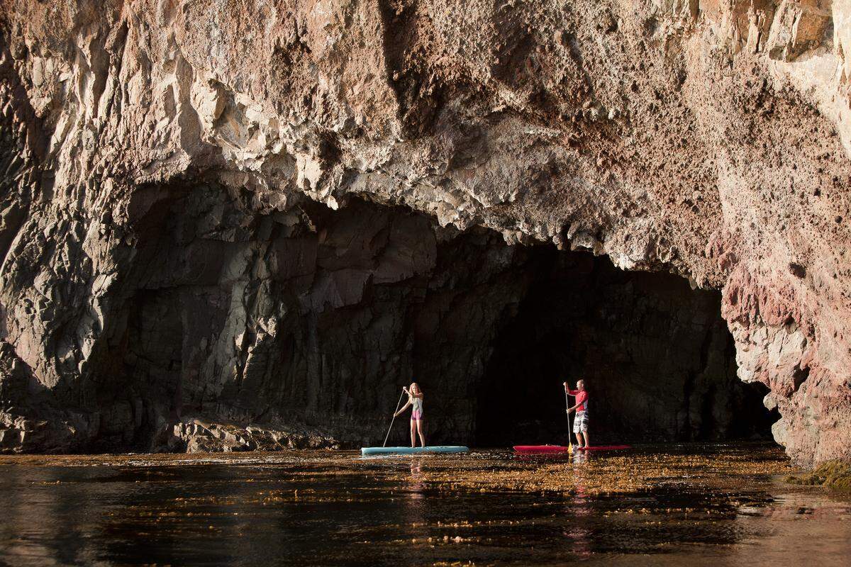 Try out kayaking or paddle boarding off the coast of Catalina Island, California, one of the Channel Islands.