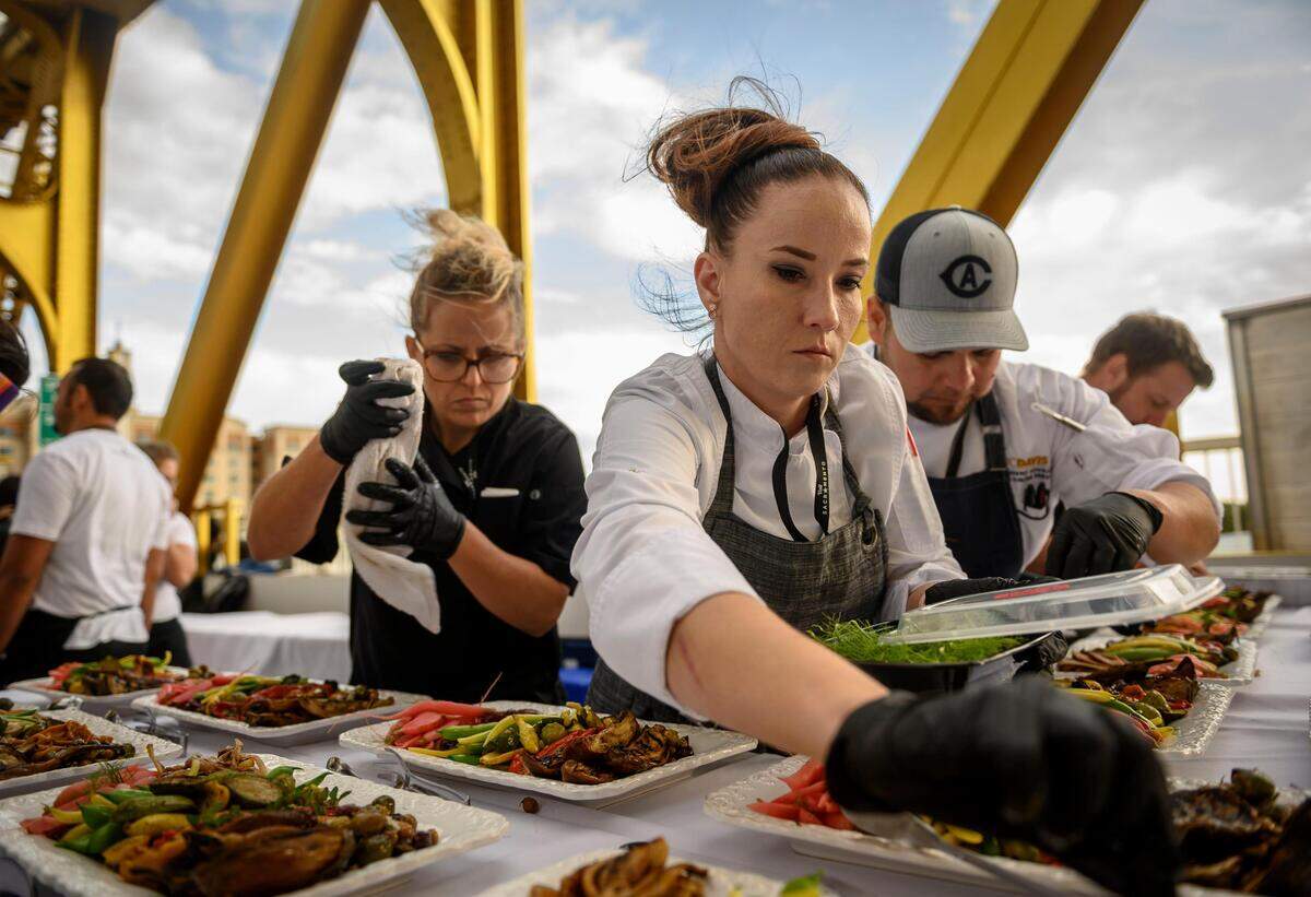 22. Chefs prepare vegetable platters to be served at the Tower Bridge Dinner on the landmark bridge leading into Sacramento, Sunday, Sept. 29, 2019. The dinner is in its seventh year.