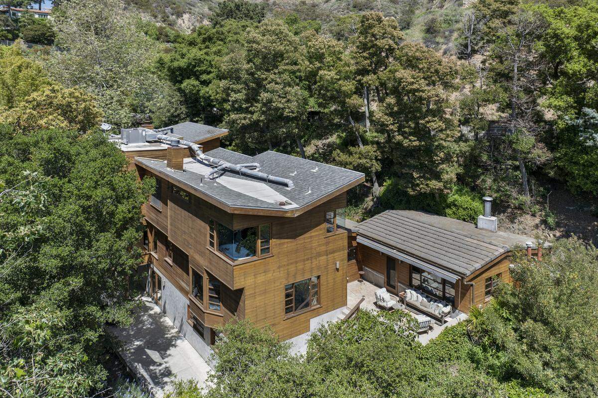 Listed for $5.9 million, the home sits on botanical grounds and projects nature-meets-modern vibes both inside and out.