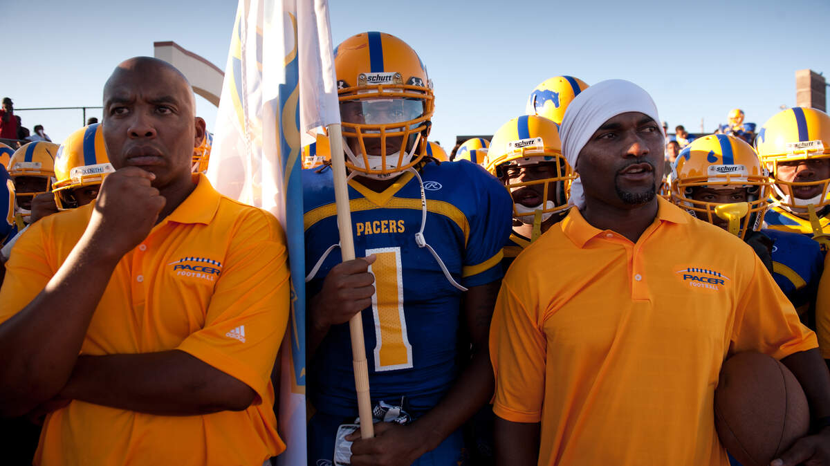 Pacer Shaq Thompson stands between Grant coaches Reggie Harris (left) and Edward Coleman before they took the field against the Folsom Bulldogs in 2011.