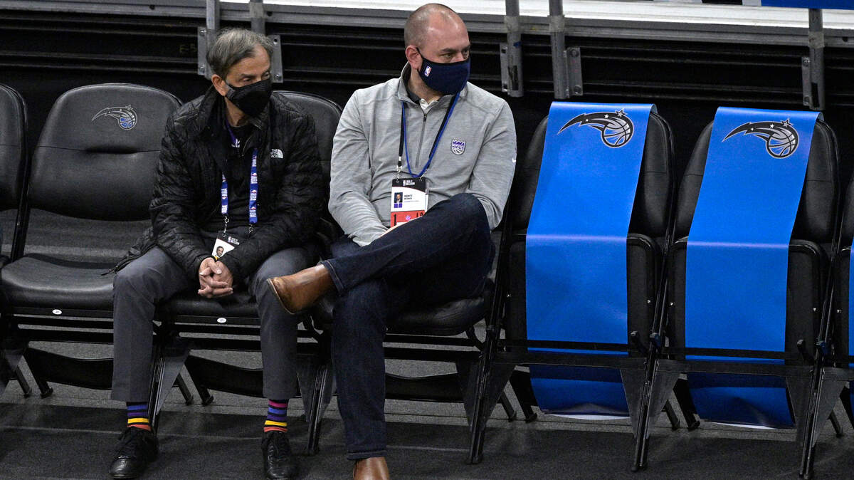 Sacramento Kings general manager Monte McNair, right, watches from court side seats during the first half of an NBA basketball game against the Orlando Magic, Wednesday, Jan. 27, 2021, in Orlando, Fla. (AP Photo/Phelan M. Ebenhack)