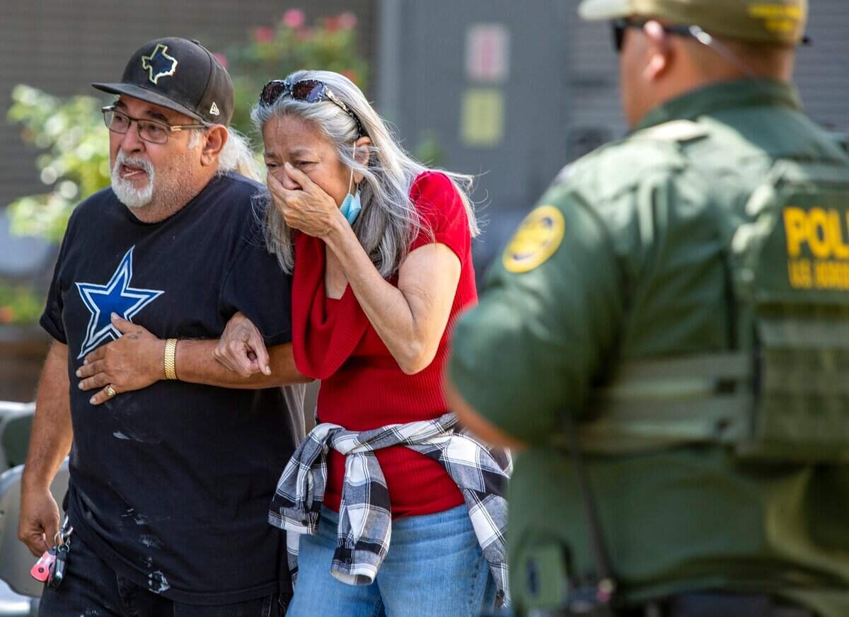 A woman cA woman cries as she leaves the Uvalde Civic Center on May 24, 2022 in Uvalde, Texas where 19 students and two teachers were killed in a mass shooting at a South Texas elementary school. The 18-year-old gunman also died.