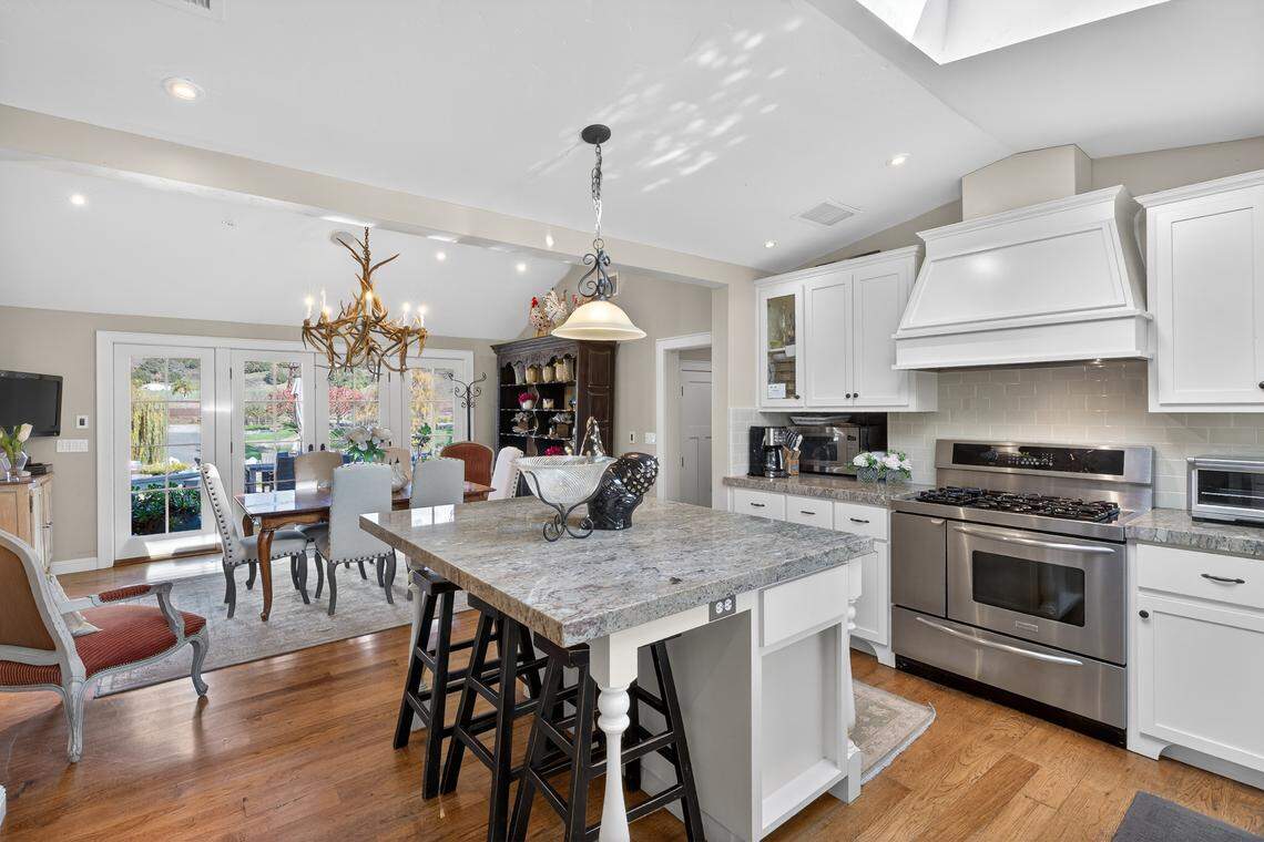 The main house is about 4,222 square feet with four bedrooms and three bathrooms, plus an additional 1,180-square-foot finished basement.