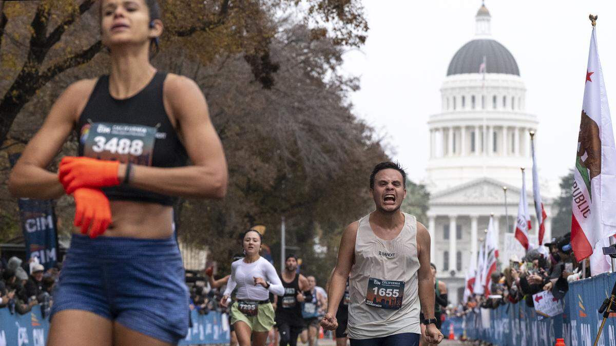 Brayan Ulloa Martinez celebrates as he crosses the finish line of the California International Marathon in Sacramento. The Sacramento Bee spoke with Brandon Hassid, Assistant Team Physician for UC Davis Athletics, about the benefits and best practices for beginning runners.
