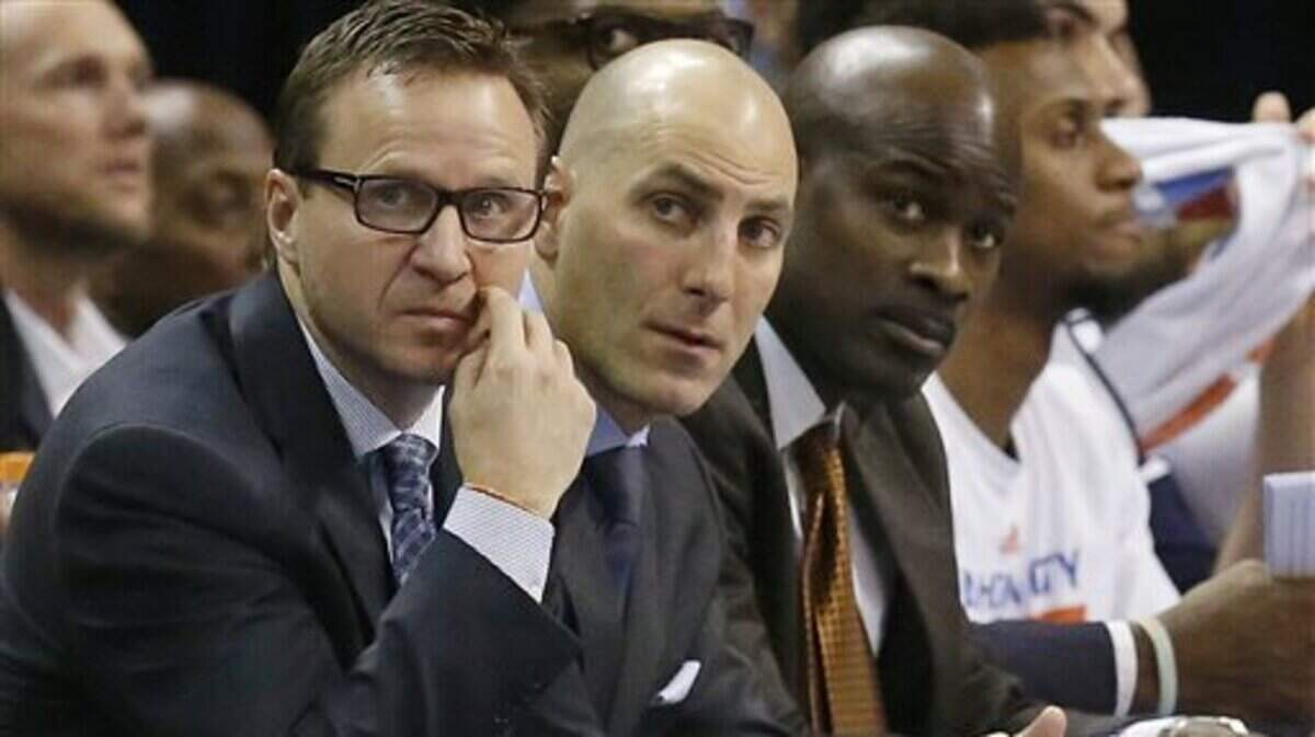 In this Jan. 9, 2015, file photo, Oklahoma City Thunder head coach Scott Brooks, left, and assistant coaches Rex Kalamian, center, and Robert Pack, right, watch from the bench.