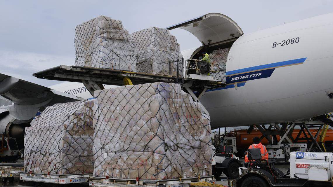 FILE - In this April 10, 2020, file photo, ground crew at the Los Angeles International airport unload pallets of supplies of medical personal protective equipment from a China Southern Cargo plane upon its arrival. An Associated Press review of more than 20 states found that before the coronavirus outbreak many had at least a modest supply of N95 masks, gowns, gloves and other medical equipment. But those supplies often were well past their expiration dates, left over from the H1N1 influenza outbreak a decade ago. (AP Photo/Richard Vogel, File)