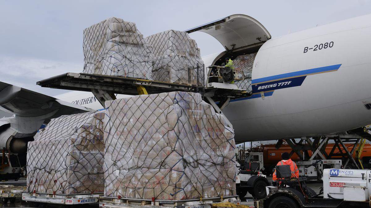 FILE - In this April 10, 2020, file photo, ground crew at the Los Angeles International airport unload pallets of supplies of medical personal protective equipment from a China Southern Cargo plane upon its arrival. An Associated Press review of more than 20 states found that before the coronavirus outbreak many had at least a modest supply of N95 masks, gowns, gloves and other medical equipment. But those supplies often were well past their expiration dates, left over from the H1N1 influenza outbreak a decade ago. (AP Photo/Richard Vogel, File)