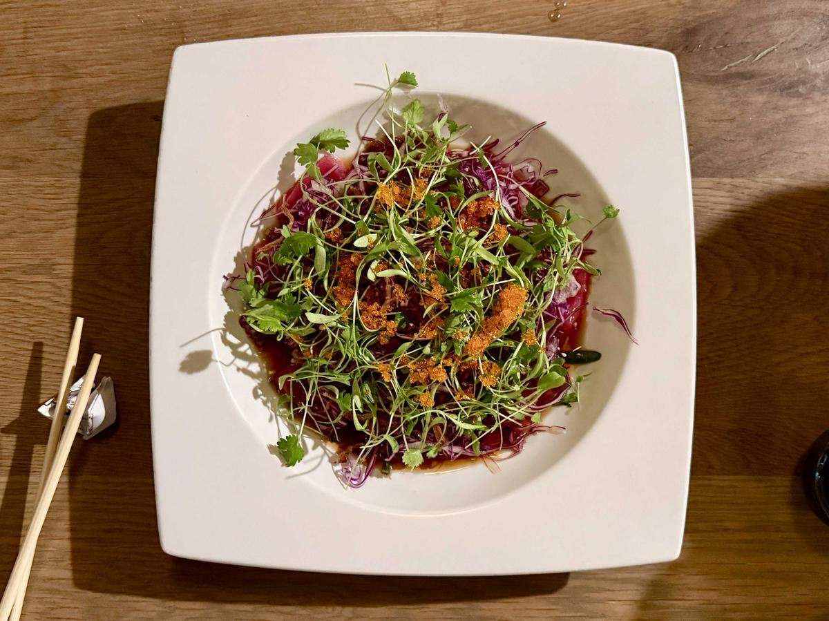 The Tuna Blossom appetizer at South Land Park's Sushi Q features tuna topped with micro cilantro, cabbage, tobiko and serrano peppers in a garlic ponzu sauce.