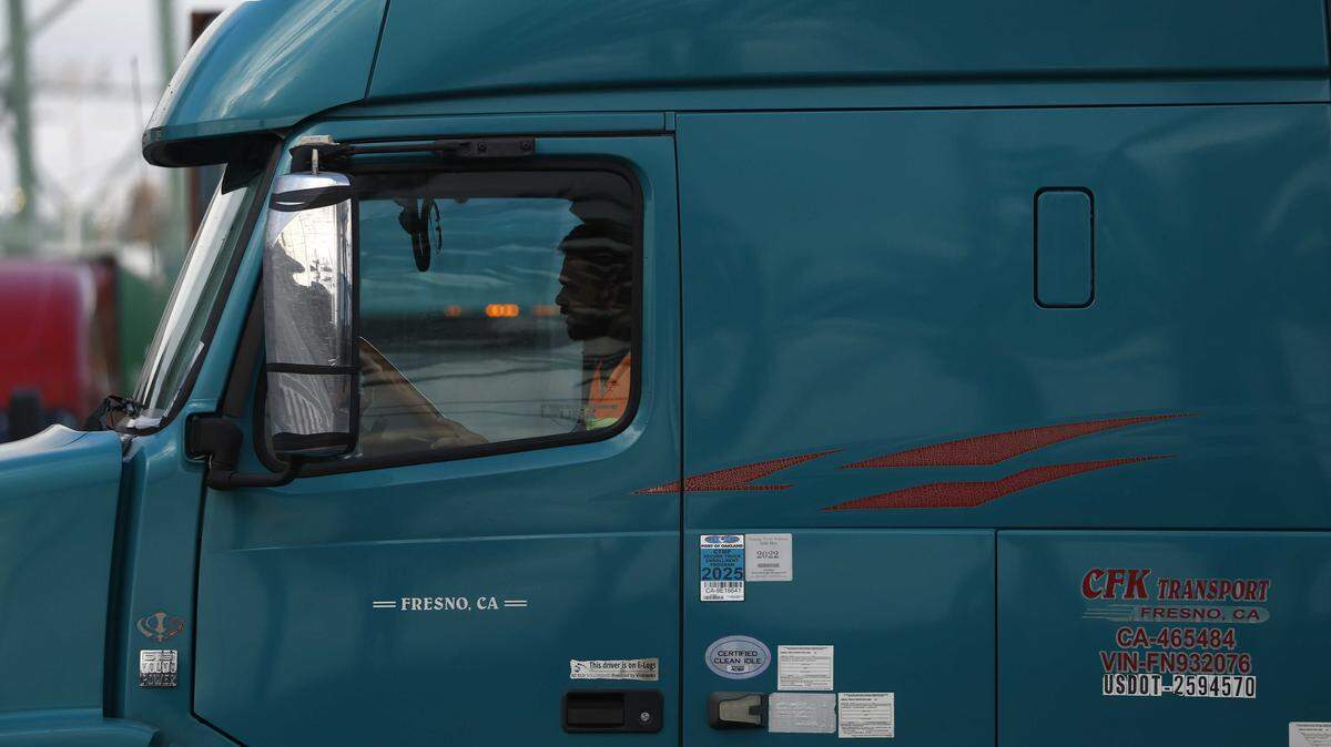 A truck drives through the Port of Oakland in November. A ruling last week noted that the DMV likely violated state law in its effort to cancel commercial licenses, said an attorney for one of the groups who sued over the move. A written order in the case, which would include an avenue for drivers to reapply for licenses, is expected this week.