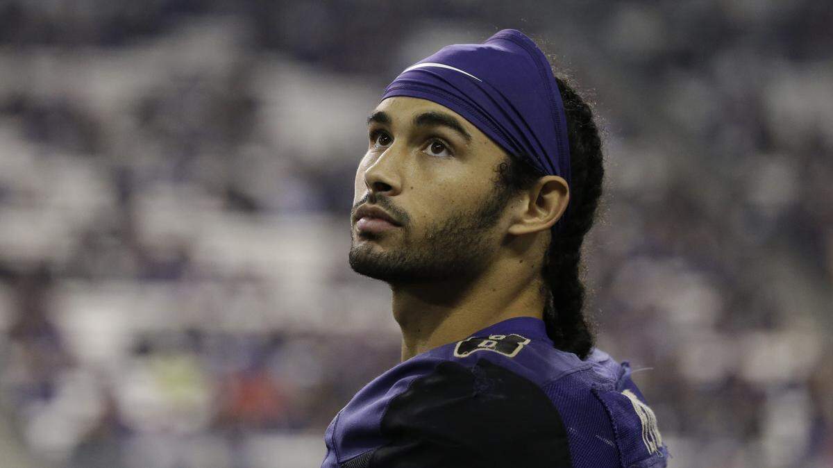 Washington's Dante Pettis stands on the sidelines late in the second half of an NCAA college football game Saturday, Sept. 16, 2017, in Seattle. Washington won 48-16.