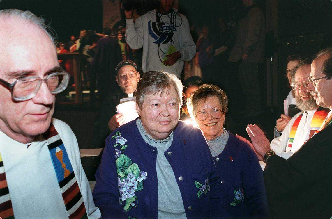 The Rev. Don Fado of St. Mark’s United Methodist Church leads Jeanne Barnett, left, and Ellie Charlton from the Sacramento Community Theater on Jan. 16, 1999, after officiating their holy union ceremony. The couple thanked 500 supporters gathered outside in a “circle of love,” while another 1,000 attended inside.