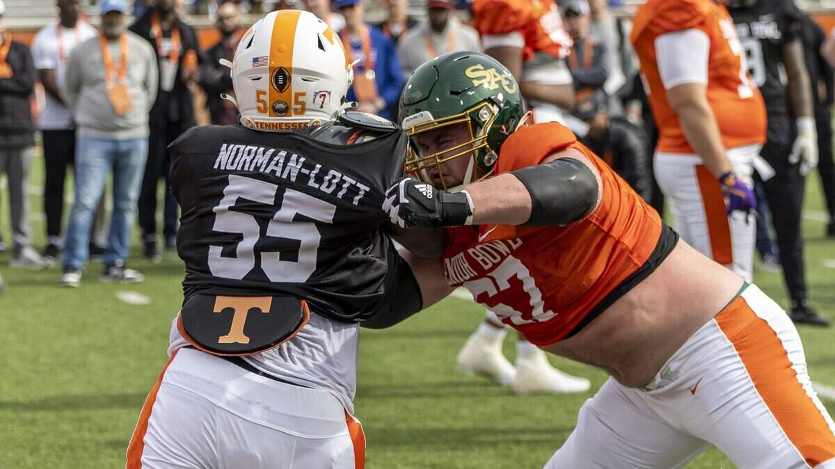 Jan 28, 2025; Mobile, AL, USA; American team defensive lineman Omarr Norman-Lott of Tennessee (55) spars with American team offensive lineman Jackson Slater of Sacramento State (67) during Senior Bowl practice for the American team at Hancock Whitney Stadium. Mandatory Credit: Vasha Hunt-Imagn Images