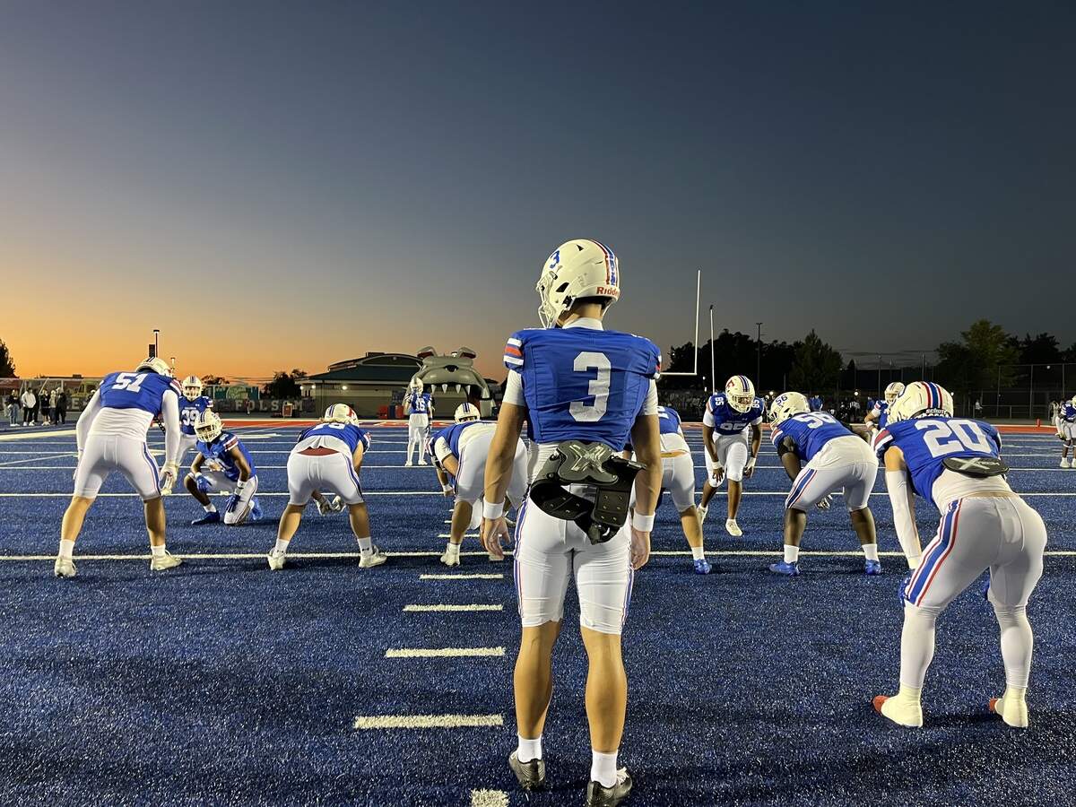 Folsom quarterback Ryder Lyons (3) loosens up his tender ankle before kicking off against Oak Ridge on Friday, Oct. 3, 2025. He passed for three second-half touchdowns to spark a 28-9 Folsom win.