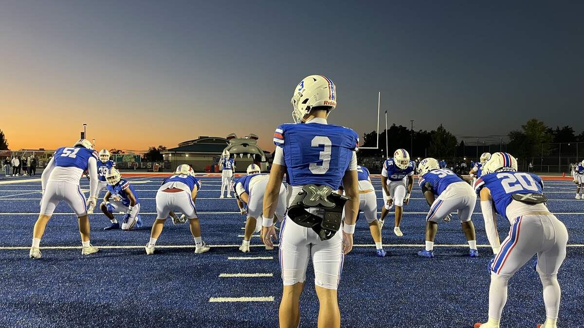 Folsom quarterback Ryder Lyons (3) loosens up his tender ankle before kicking off against Oak Ridge on Friday. He passed for three second-half touchdowns to spark a 28-9 Folsom home win.