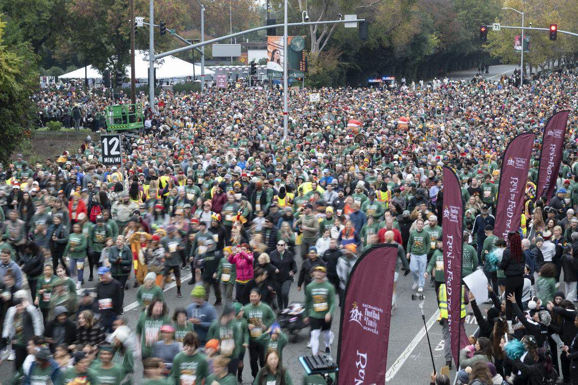 Runners in the 5k race start running during the Run to Feed the Hungry in Sacramento on Thursday.