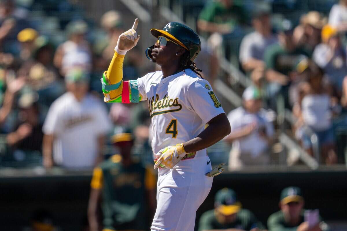 Aug 17, 2025; West Sacramento, California, USA; Athletics center fielder Lawrence Butler (4) celebrates at home plate after hitting a solo home run against the Los Angeles Angels during the sixth inning at Sutter Health Park. Mandatory Credit: Neville E. Guard-Imagn Images