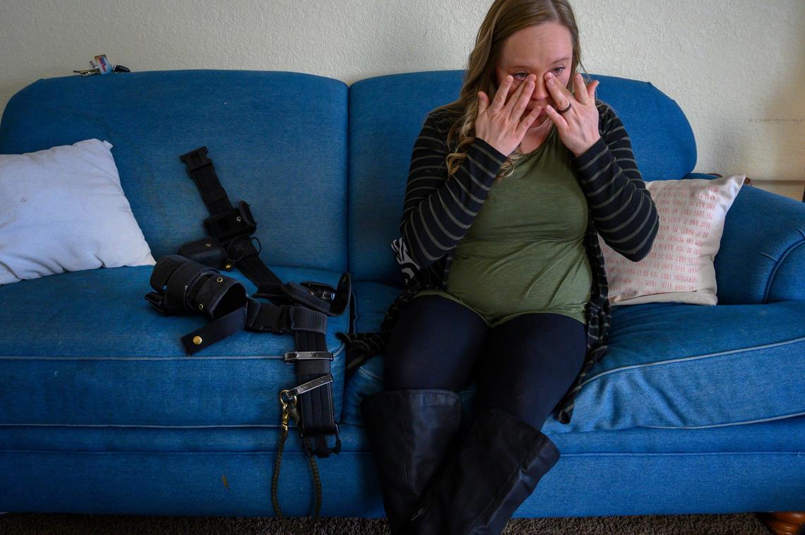 Corrections officer Angela Powell, who works in Vacaville, wipes tears from her eyes on March 29 after talking about fellow officer Sarah Coogle, who fell while working a shift in Tehachapi and gave birth to a stillborn child two months later. Coogle and Powell are part of a class action lawsuit that seeks temporary accommodations for pregnant prison guards. “It’s scary. I’m thankful I didn’t have to go through what she went through. I got to bring my child home – she didn’t,” said Powell, who is pregnant with her second child.
