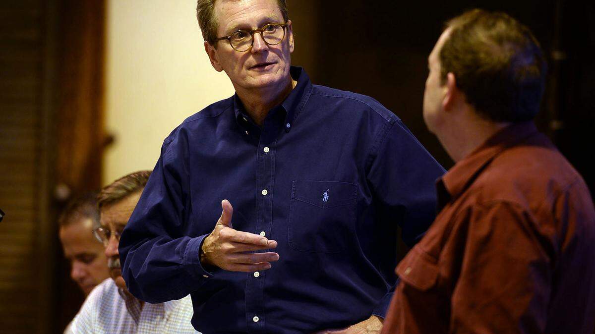 Westlands Water District’s Tom Birmingham speaks with Ron Milligan, right, operations manager for the Central Valley Project, during a meeting with Westlands Water District farmers on June 18, 2013, about summer water allocations. The farmers’ allotment was trimmed drastically after federal agencies reduced water pumping in the Sacramento Delta to protect endangered fish.