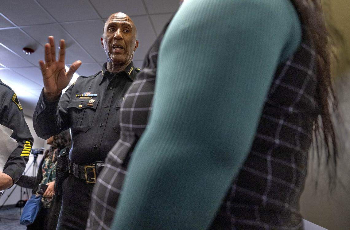 Sacramento Sheriff Jim Cooper speaks with a victim of David Allen Funston, who was convicted of kidnapping and child molestation in 1999, after a news conference on Monday, Feb. 23, 2026 at the Sheriff's office headquarters. 