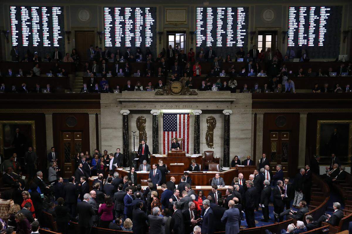 The vote count is projected on the walls of the House of Representatives as Speaker of the House Nancy Pelosi, D-Calif., presides over voting on the impeachment of President Donald Trump at  the U.S. Capitol on Dec. 18, 2019 in Washington, D.C. The House passed two articles of impeachment on charges of abuse of power and obstruction of Congress.