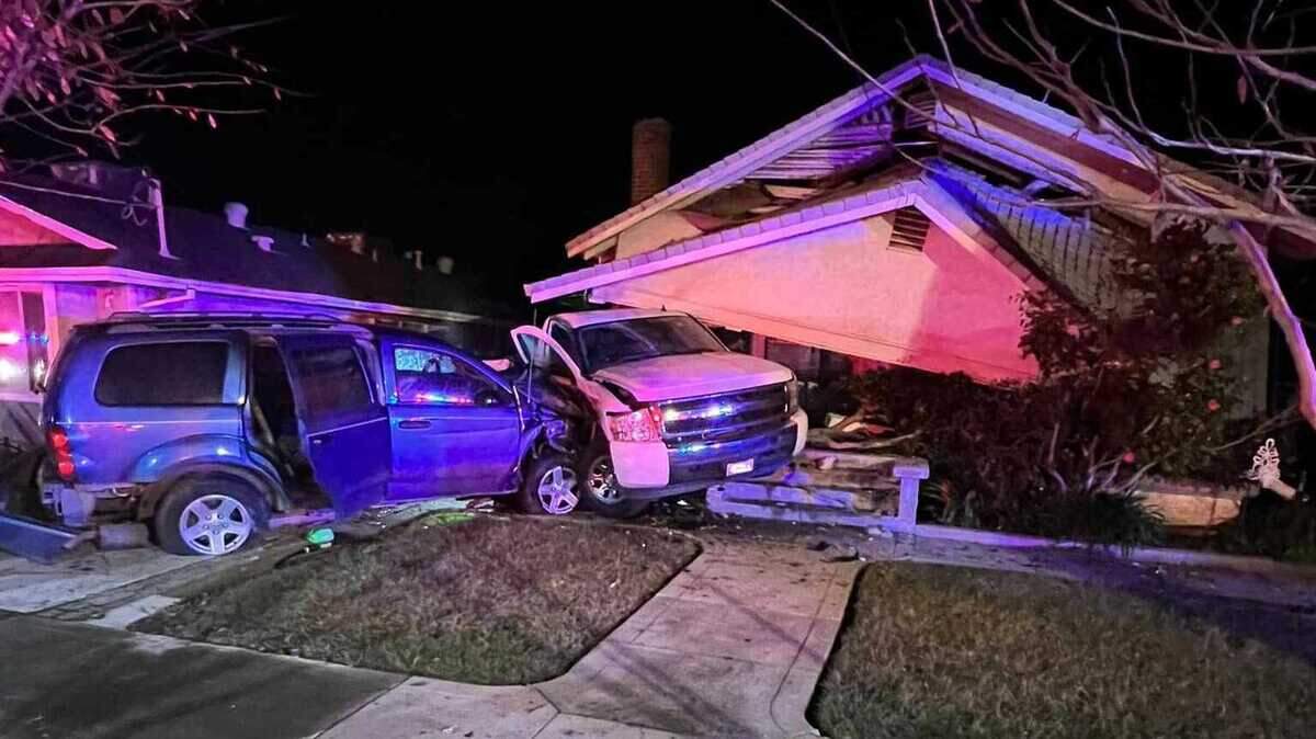The roof collapsed at a home near Cooper Avenue and Wilkie Way in Yuba City, California, after a blue Dodge Durango struck a parked white Chevrolet Silverado in a suspected DUI crash, the Yuba City Police Department announced Friday, Jan. 13, 2023.