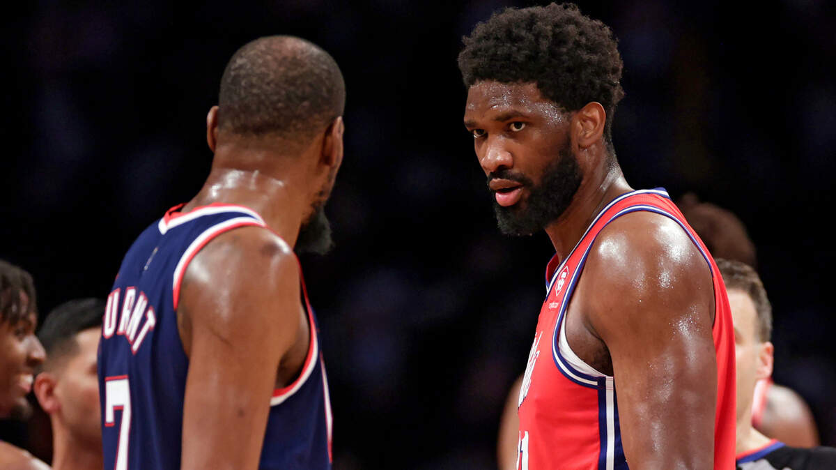 Philadelphia 76ers center Joel Embiid stares down Brooklyn Nets forward Kevin Durant during the second half of an NBA basketball game Thursday, Dec. 30, 2021, in New York. 76ers won 110-102. (AP Photo/Adam Hunger)