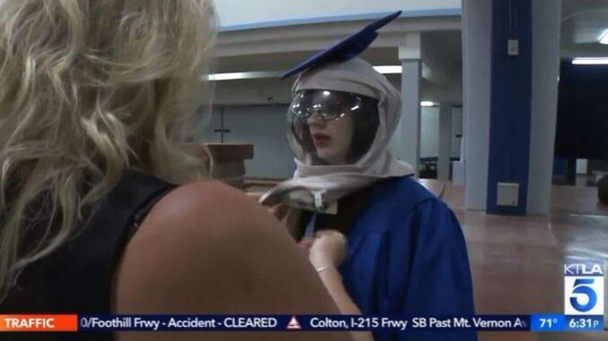 Pam McCoy outfits her daughter, Riley McCoy, 18, with a special hood so she graduate with her friends Thursday at Dana Hills High School in Dana Point, California. Riley has xeroderma pigmentosum, a rare skin condition that makes going out in the sun dangerous.