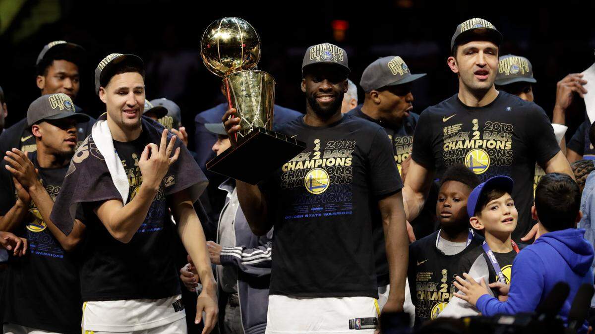 The Golden State Warriors celebrate after beating the Cleveland Cavaliers for their third NBA championship in the last four seasons.