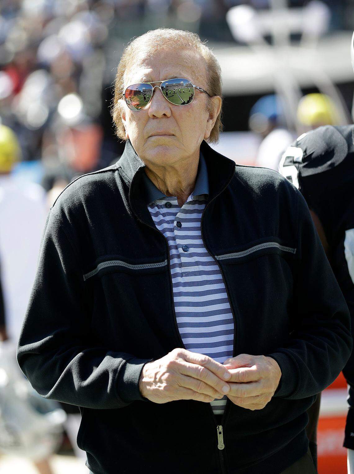 Former Oakland Raiders coach Tom Flores walks the sidelines before a 2016 game. He says he’ll be on the field Sunday when the game ends “to get that last surge of energy that you get from the crowd.”