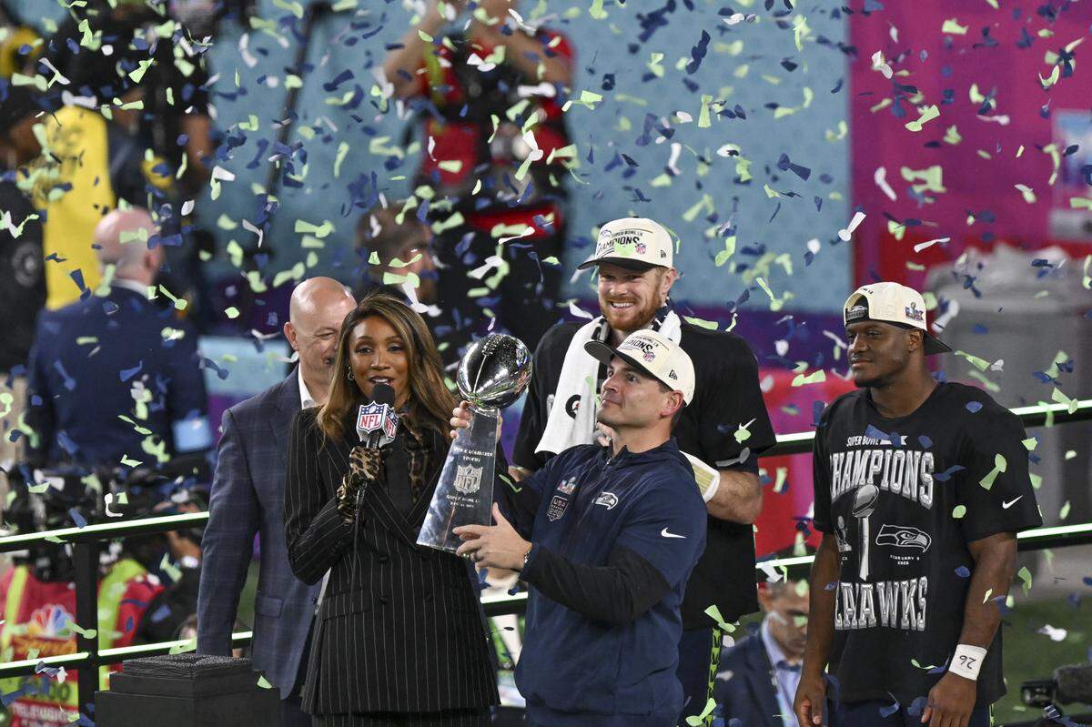 Seattle Seahawks head coach Mike Macdonald lifts the Lombardi Trophy after the Seahawks win Super Bowl LX at Levi’s Stadium in Santa Clara on Sunday, Feb. 8.