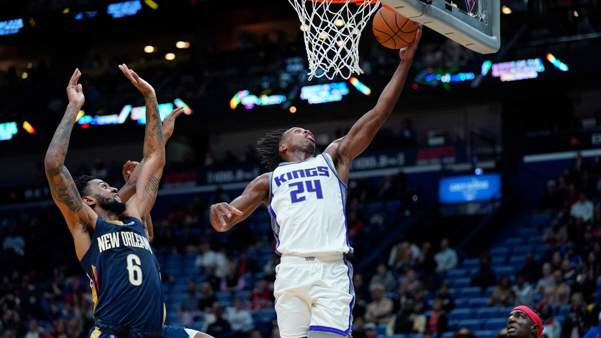 Sacramento Kings guard Buddy Hield (24) goes to the basket against New Orleans Pelicans guard Nickeil Alexander-Walker (6) in the first half of an NBA basketball game in New Orleans, Friday, Oct. 29, 2021. (AP Photo/Gerald Herbert)