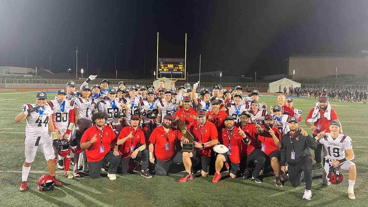 The Woodland Christian High School football team celebrates after beating Banning of Wilmington in the CIF state Division 5-A championship game at El Camino College in Torrance.