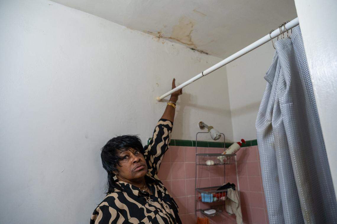Jacqueline Saffo points to water damage in October and says she worries about the ceiling in her bathroom falling.