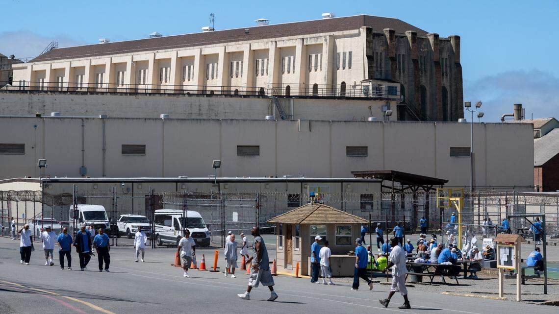 Inmates exercise outside in the yard at San Quentin State Prison, since renamed the San Quentin Rehabilitation Center, in San Rafael on July 26. A recent report from the Office of the Inspector General found that 11 facilities in the state prison system provide “inadequate” levels of medical care to inmate patients.