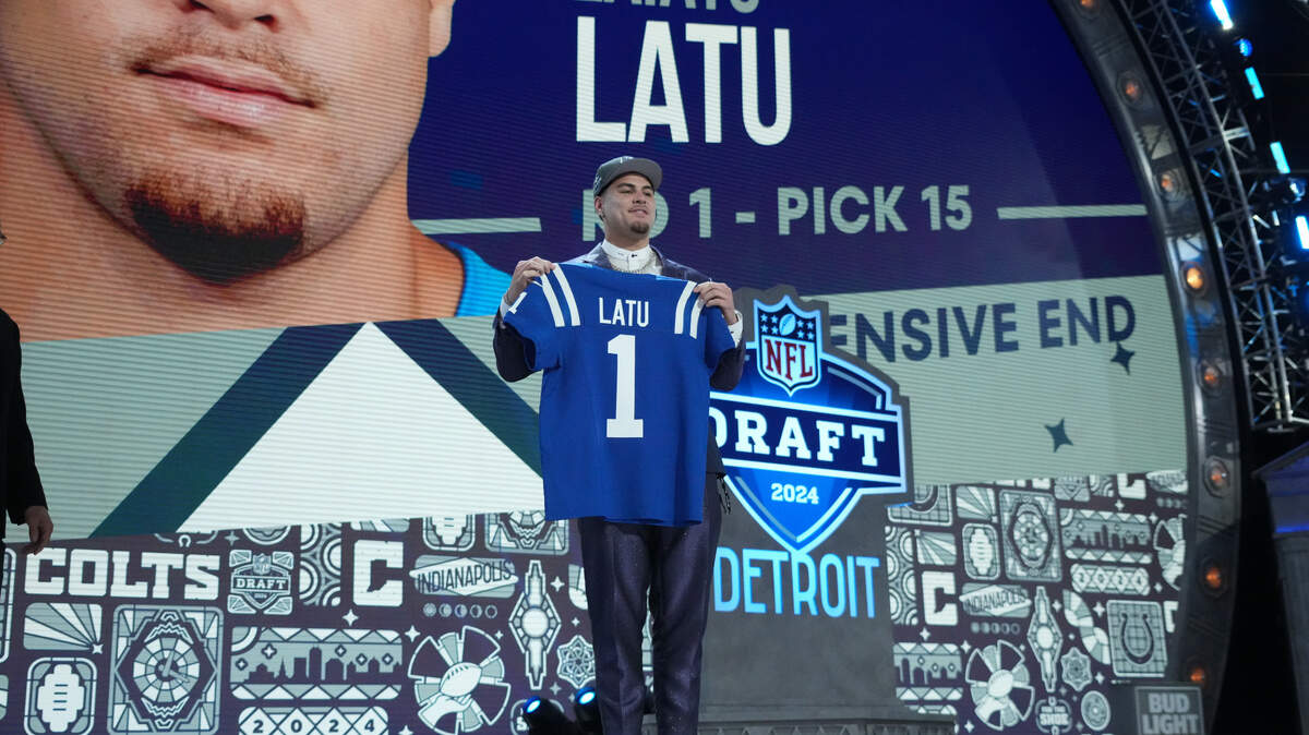 UCLA Bruins defensive lineman Laiatu Latu poses after being selected by the Indianapolis Colts as the No. 15 pick in the first round of the 2024 NFL Draft on Thursday at Campus Martius Park and Hart Plaza in Detroit, Michigan.