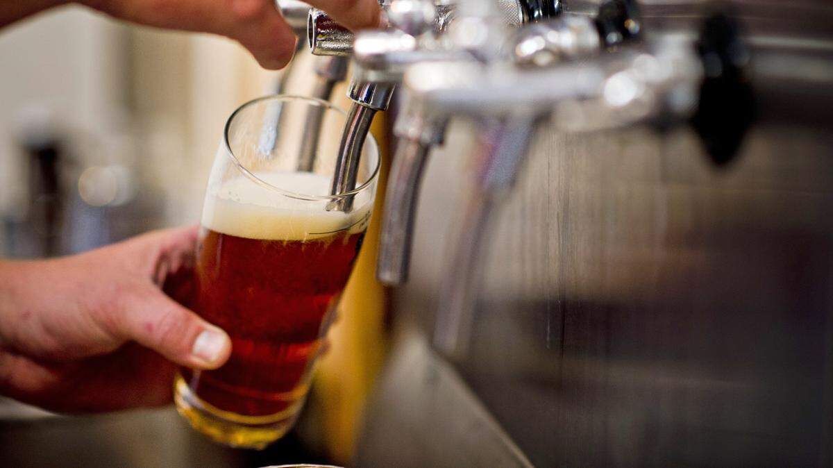 Beer flows from one of the taps at award-winning Sudwerk Brewing Company during a beer tasting at the venerable Davis brewery.