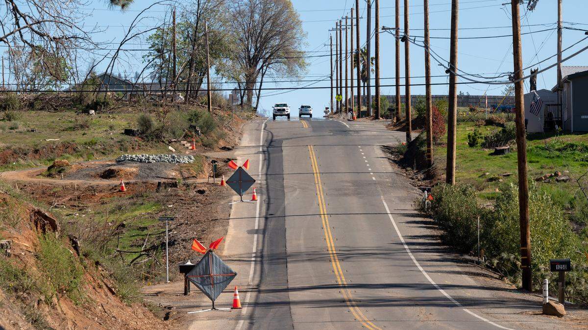 Newly install underground utilities are marked with new asphalt after PG&E crews installed the underground utilities along Pearson Road  in February 2022 in Paradise.  PG&E was seeking a rate increase for its profits on infrastructure projects like this.  The CPUC slightly reduced the rate instead on Thursday, Dec. 18. 2025. 
