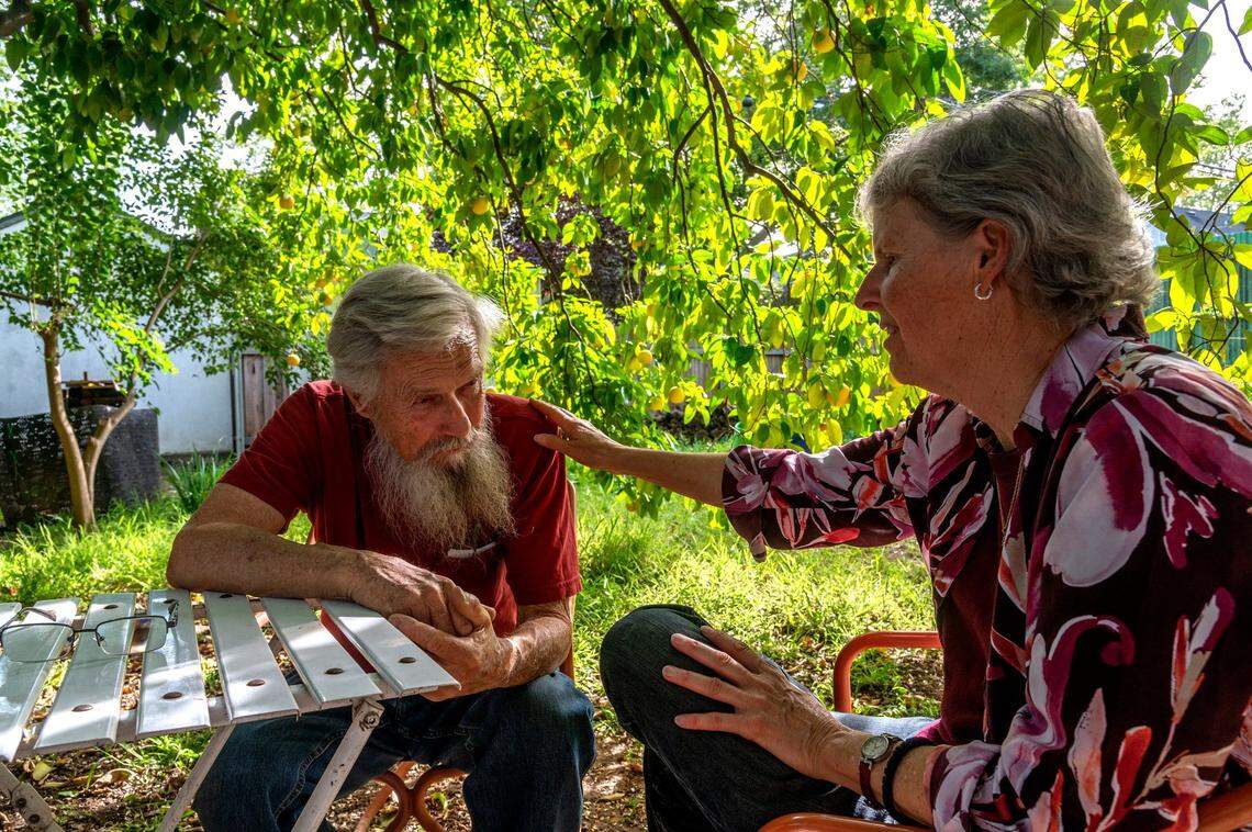 Kim Glazzard, right, shows concern for her friend Dan Altstatt on Thursday as he faces $573,000 in fees from the city for minor code violations in a legal fight over the past seven years.