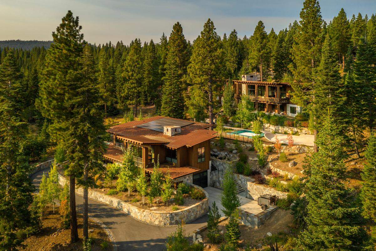 The two-home property spans nearly three acres in Lake Tahoe’s four-season community of Martis Camp.