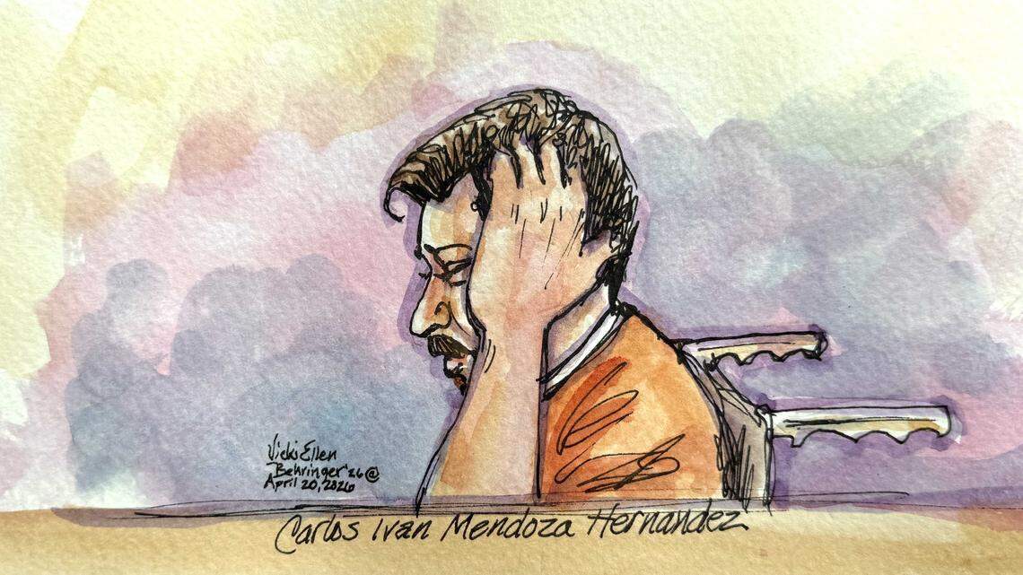 Carlos Ivan Mendoza Hernandez grasps the side of his head while seated in a wheelchair during a hearing in Sacramento federal court on Monday, April 20, 2026. U.S. District Judge Dale Drozd ruled that Mendoza Hernandez should be detained pending trial after prosecutors objected to a magistrate judge’s earlier decision to release him.