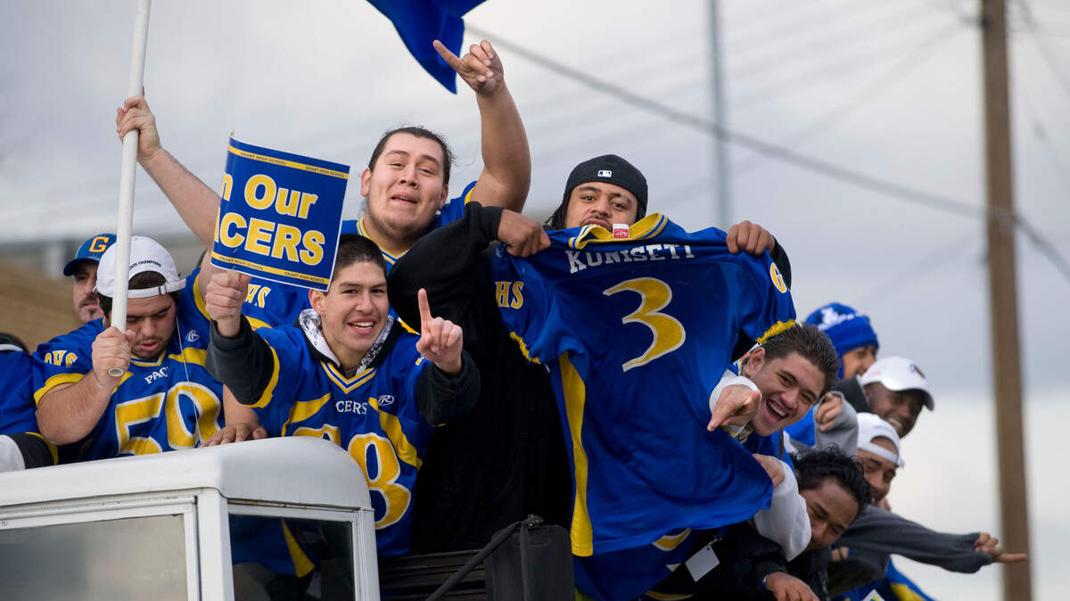 Grant High School football players celebrate their state championship victory with a parade along Del Paso Boulevard in 2008.
