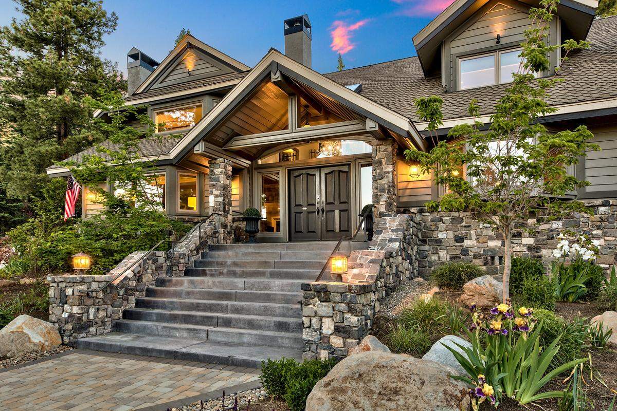 The exceptional residence at 714 Champagne Road in Lake Tahoe boasts seven spacious bedrooms, including a charming bunk room, seven bathrooms and a separate pool house