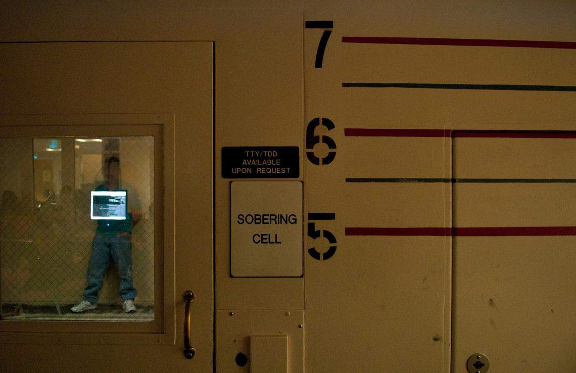 An inmate stands inside the sobering cell at the Sacramento Main Jail on April 30, 2009. Inmates are placed in the “drunk tank” until they are sober enough to be release or transferred to a different area of the jail.