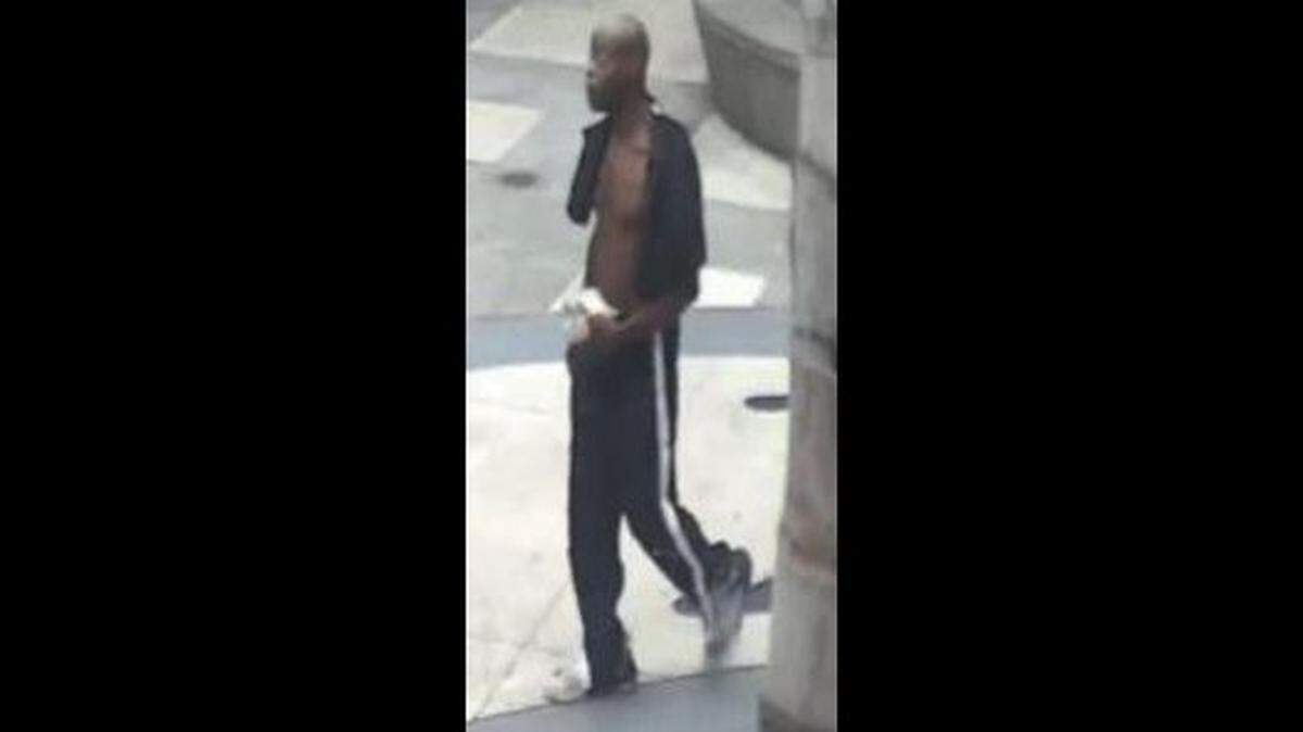 A man accused of attacking a 76-year-old man waiting for a ride in Los Angeles, California, with fists and an electric scooter June 13 has been arrested after police circulated security camera photos of him, above.