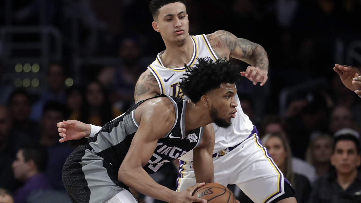 Sacramento Kings rookie Marvin Bagley III, front, is defended by Kyle Kuzma of the Los Angeles Lakers in the first half March 24 in Los Angeles. (AP Photo/Marcio Jose Sanchez)