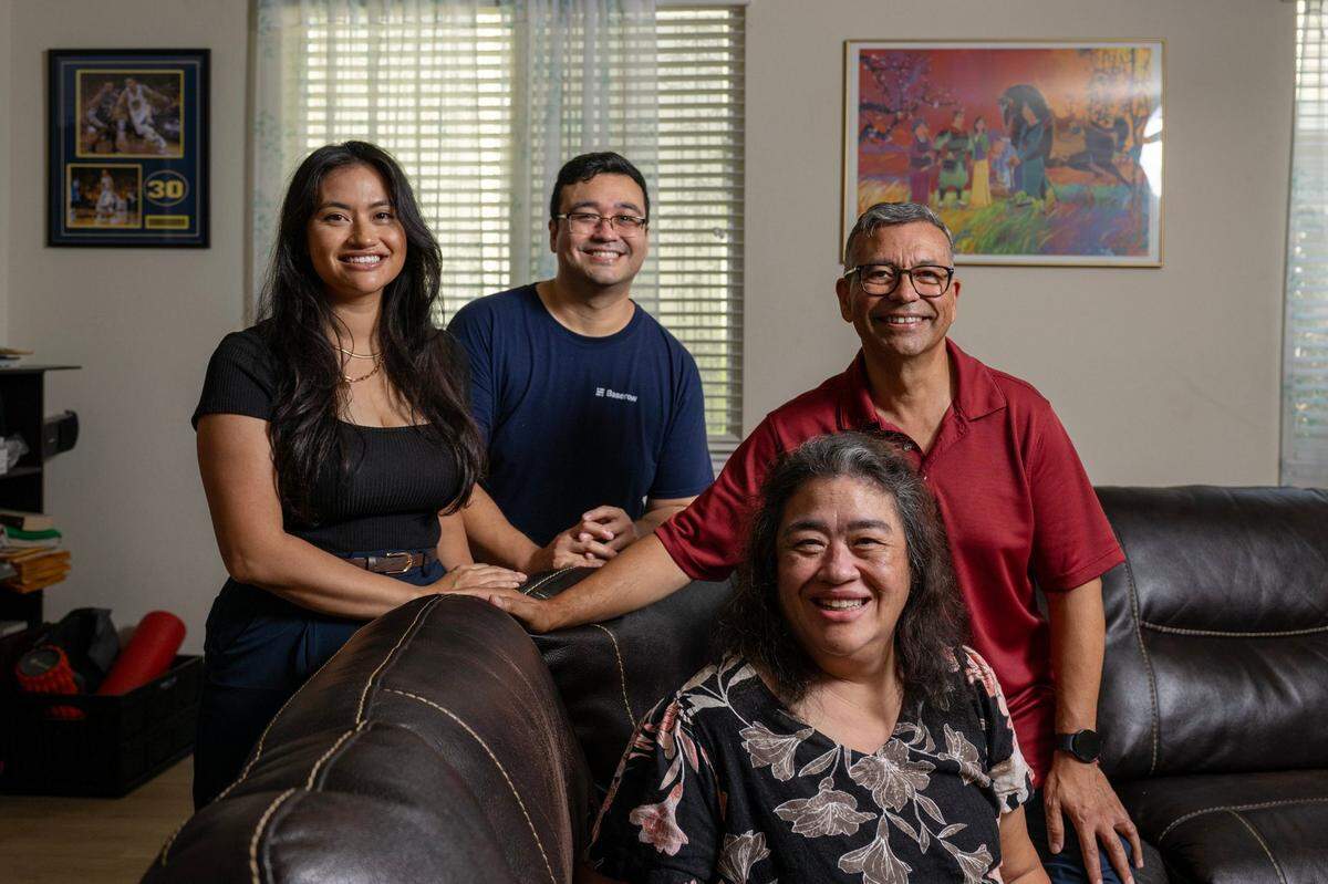 Felicia and Esteban Salinas, left, pose for a portrait with their parents, Jesse Salinas and Lisa Yep Salinas, at their home in Woodland on Aug. 18. Jesse is first-generation Mexican-American and Lisa is Chinese-American. They’ve managed to teach the complexities of both cultures to their children who share dual identities.