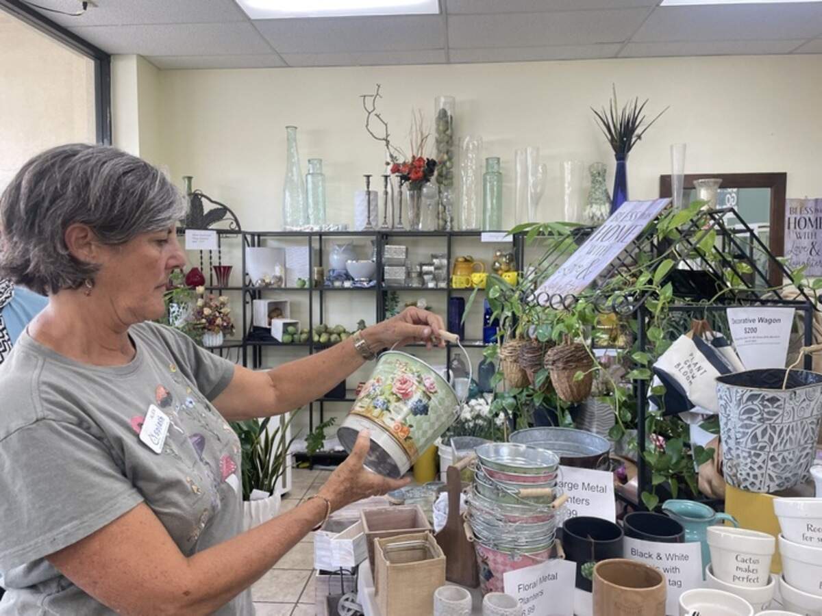 Alex Morton sees what she could buy from Laguna Flowers for her students’ field trip shopping on Thursday, October 10, 2024