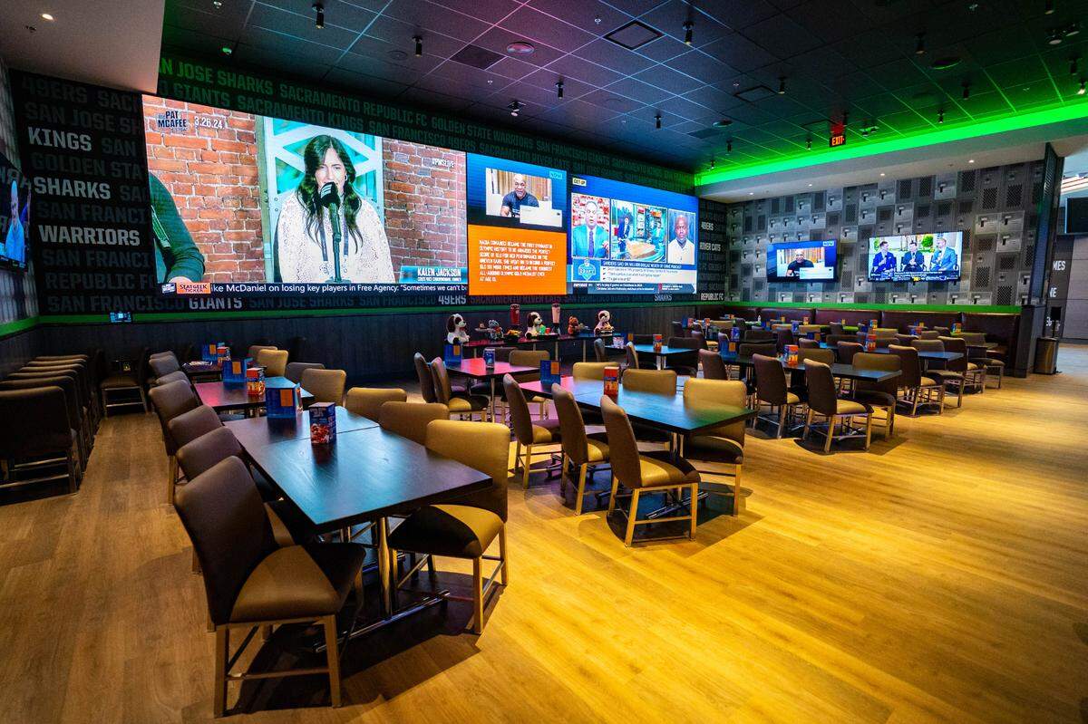 The dining area of Dave & Buster’s features a 40-foot Wow Wall screen, Tuesday, March 26, 2024.