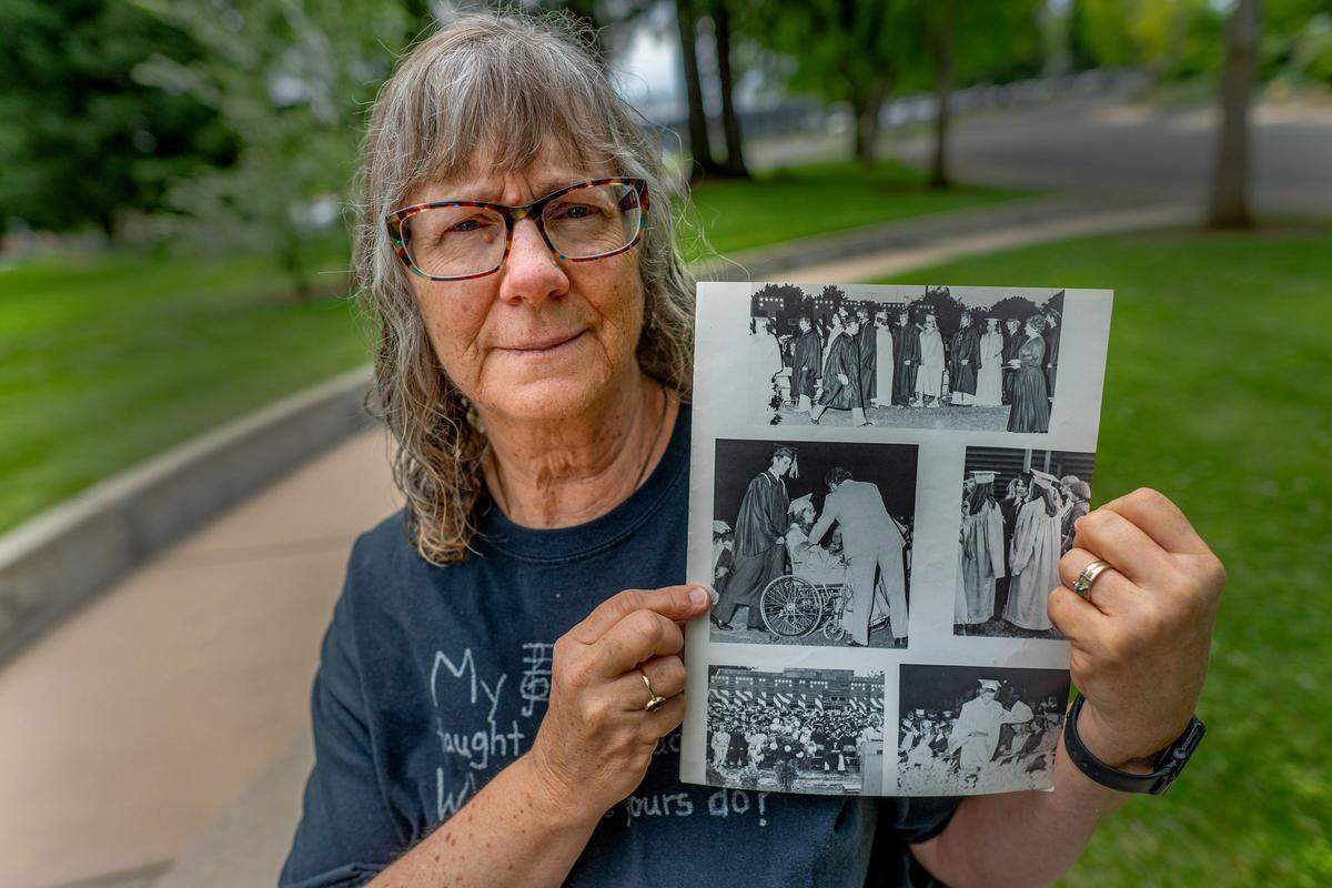 Christina Young Estabrook on Monday, May 4, 2026, in Yuba City holds a picture of herself at her high school graduation in a wheelchair in 1976 after she survived a bus crash that killed 28 fellow students and a teacher. Estabrook, who was 17, sustained several injuries, including a broken pelvis. She later married choir director Dean Estabrook, who had lost his wife in the crash and died months ago at age 85. “I’m here to honor his memory and the fact that he was such a wonderful person and loved every single one of these kids,” she said.