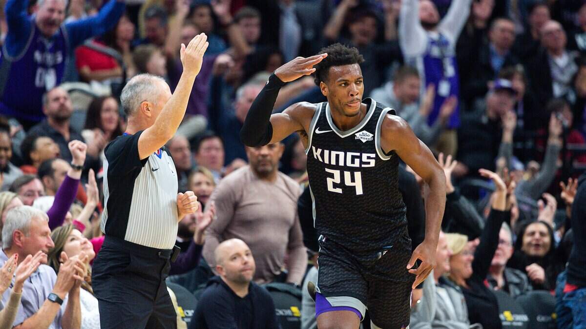 Kings guard Buddy Hield celebrates after making a 3-pointer against the Minnesota Timberwolves on Wednesday at Golden 1 Center. Hield had five of Sacramento’s franchise-record 19 3s in the 141-130 victory.